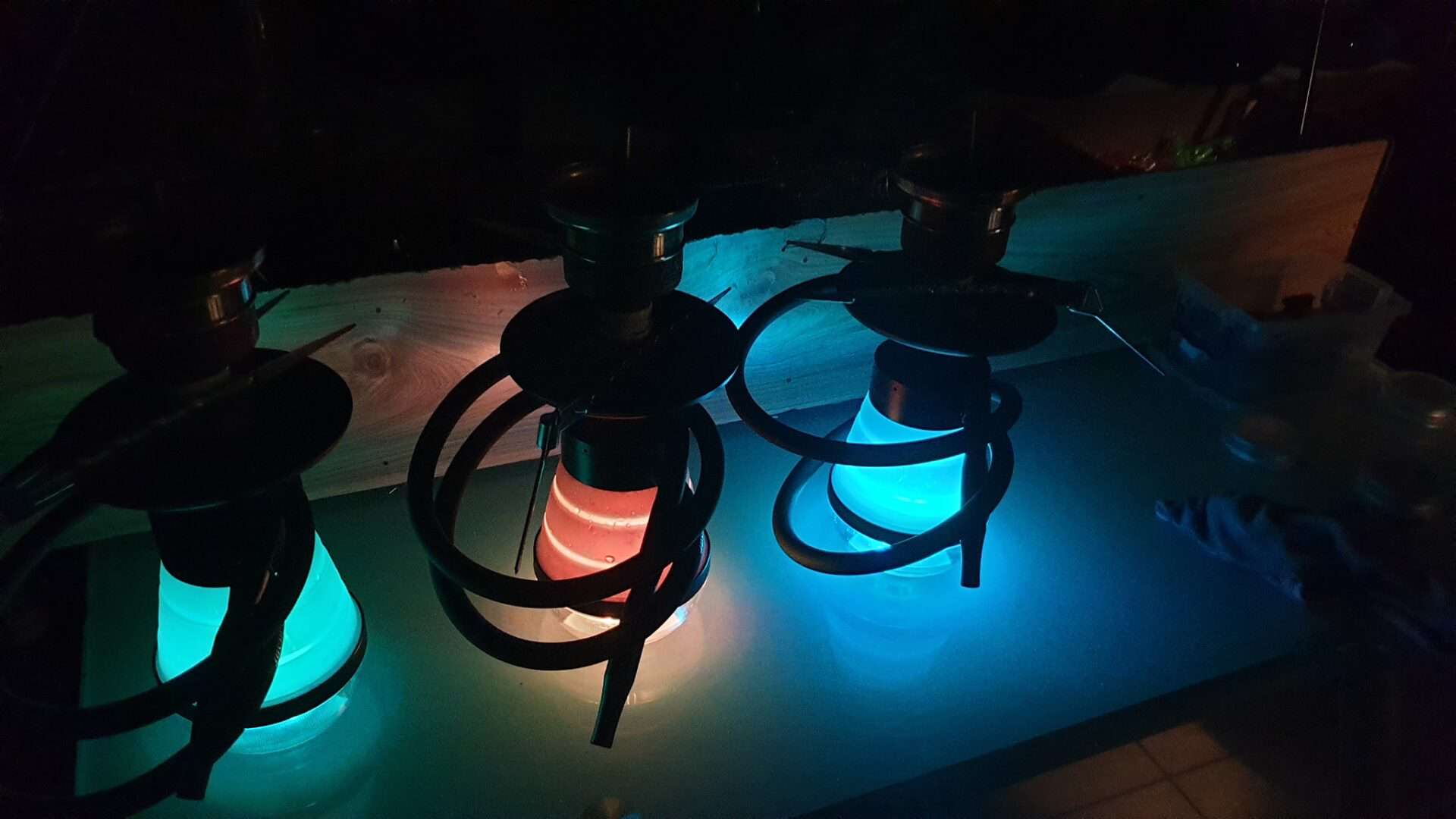 Colorful illuminated shisha pipes at Relax Cafe for shisha and sports fans.