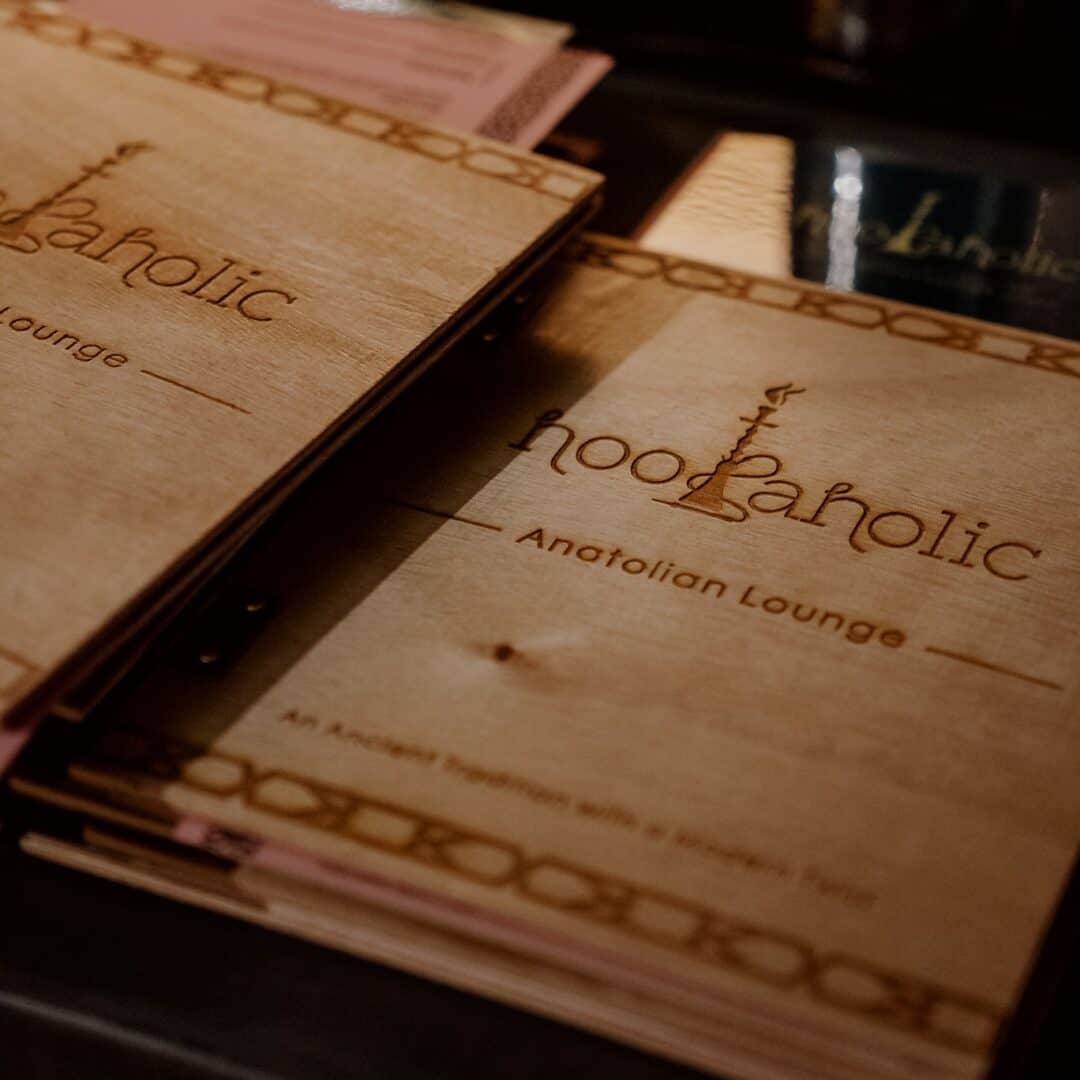Menu of Hookaholic Anatolian Lounge with traditional and modern shisha options.