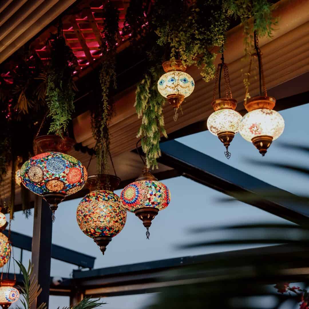 Vibrant Turkish mosaic lanterns hanging at Shisha Break lounge.