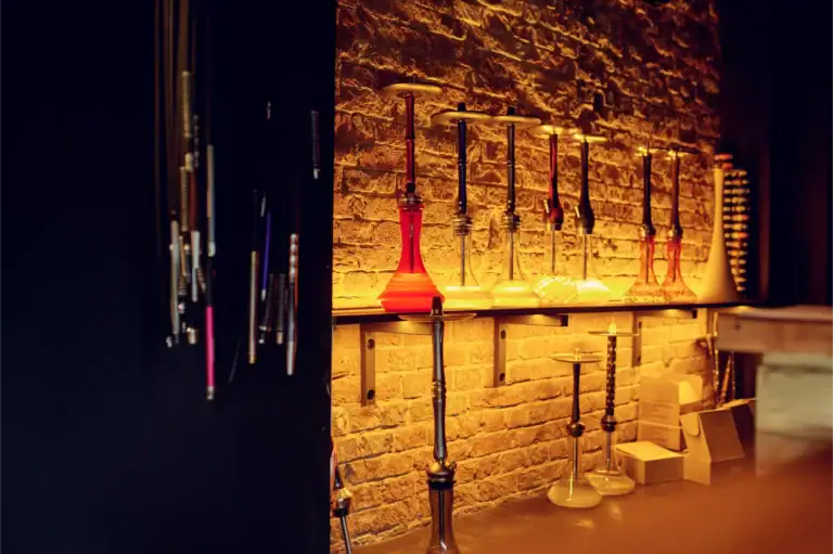 Shisha pipes and accessories displayed in a stylish lounge setting.